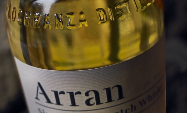 Isle of Aarran Single Malt Scotch Whisky glass bottle made by Verallia, with embossing on the neck of the bottle