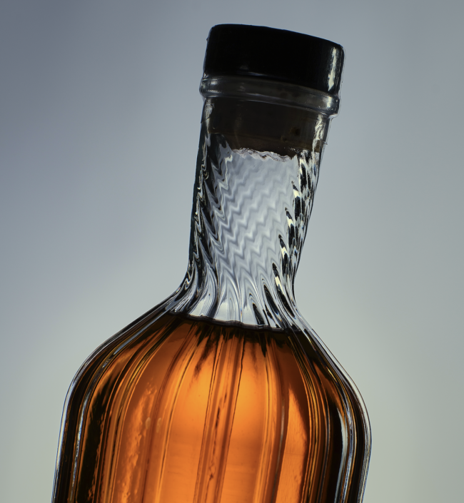 Wire Works Whisky bespoke glass bottle made by Verallia, featuring unique embossing and moulded shape