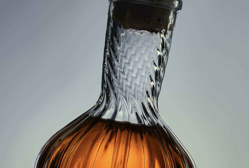 Wire Works Whisky bespoke glass bottle made by Verallia, featuring unique embossing and moulded shape