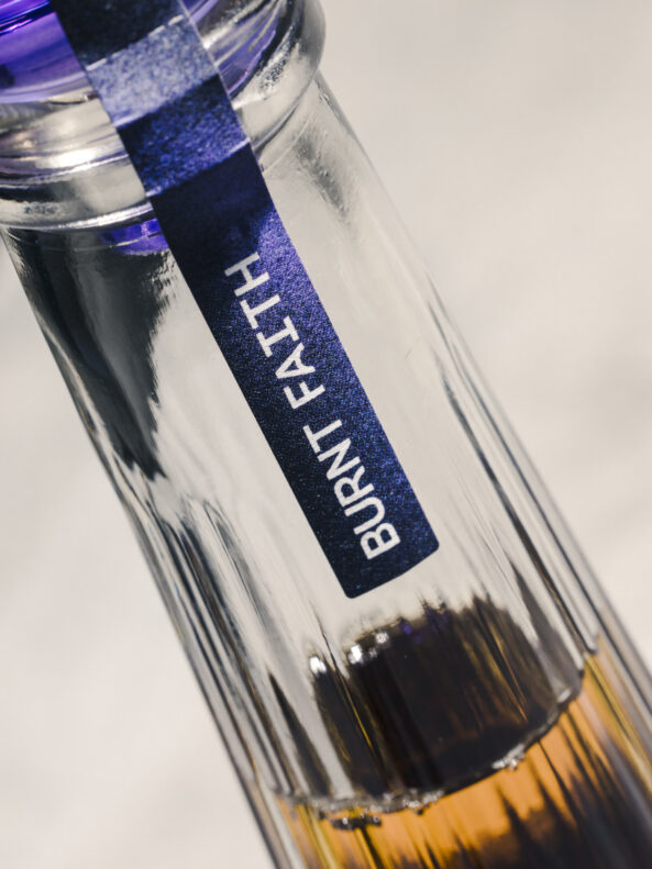 Burnt Faith brandy sustainable glass bottle made by Verallia, close up shot of the neck of the bottle