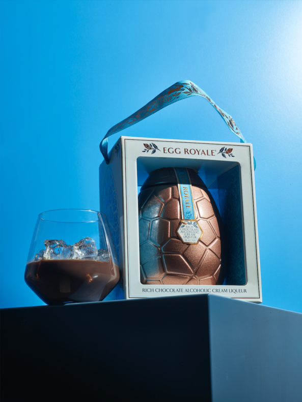Egg Royale bespoke glass bottle made by Verallia, sits in it's box.