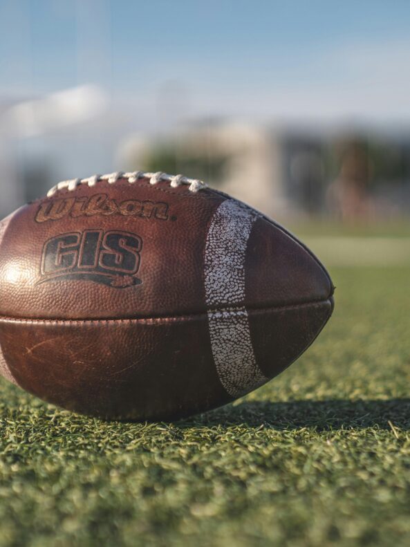 An American football that was the inspiration for the Game Time bespoke glass bottle made by Verallia.