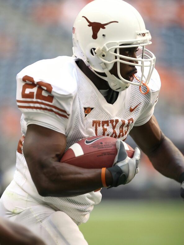 A Texas Longhorn American Football player plays as part of the branding for Game Time bespoke glass bottle made by Verallia.
